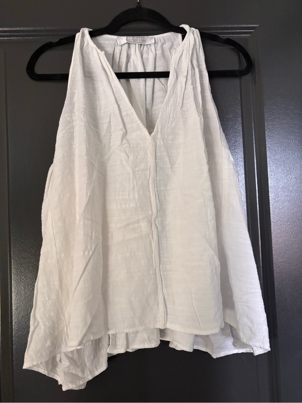 White Sleeveless V-Neck Women’s Top